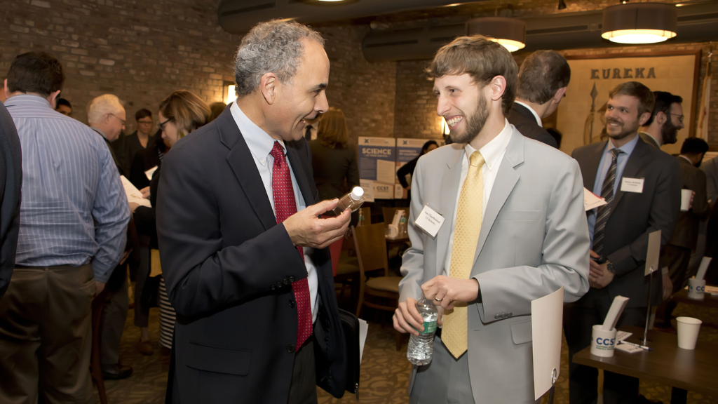 The California Council on Science and Technology (CCST) hosted the inaugural California Science Translators Showcase on Tuesday, February 20, 2018 in the Eureka Room in the California State Captiol. Organized with the support of Assemblymember Jose Medina (D-Riverside), the program recruited and trained 15 graduate students and postdocs from UC, Cal State, Stanford, and Caltech campus to communicate their research to state policymakers and staff. CCST Science Translator Joe Charbonnet (UC Berkeley) explains his research on stormwater reuse to Jose Anaya, Dean of Community Advancement at El Camino College and Statewide Sector Navigator for Advanced Manufactoring for the California Community Colleges Centers for Applied Competitive Technologies (CACT).