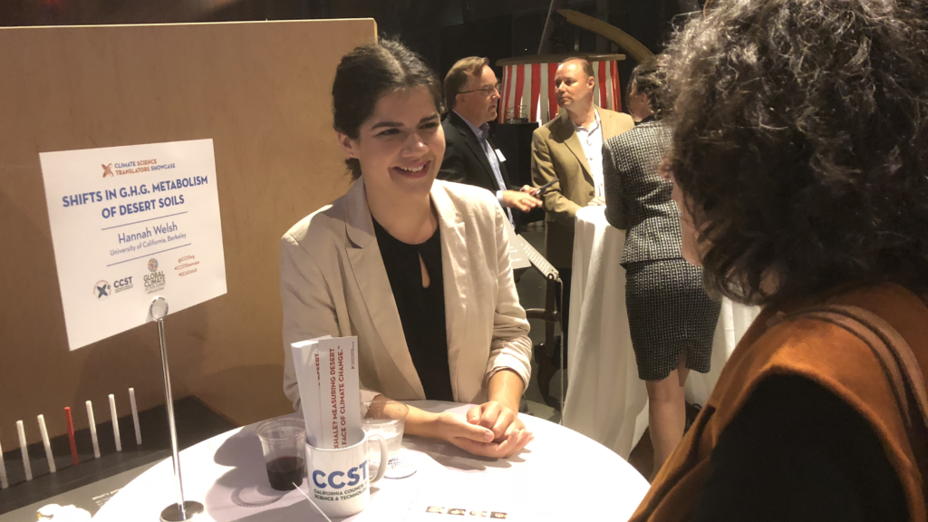 UC Berkeley doctoral student Hannah Welsh explains her research on how desert soil microbes "inhale and exhale" greenhouse gases.  The California Council on Science and Technology (CCST) hosted the CCST Climate Science Translators Showcase on Tuesday, September 11, 2018 at the Exploratorium as an Affiliate Event of the historic Global Climate Action Summit in San Francisco — held during the "Celebration of Science and Education" reception hosted by the Governor's Office of Planning and Research (OPR), CCST, the Gordon and Betty Moore Foundation, CalEPA, and Ten Strands. The #CCSTShowcase recruited and trained 12 graduate students and postdocs from California universities and research institutions to communicate their climate-related research to policy leaders, staff, and other Summit delegates.