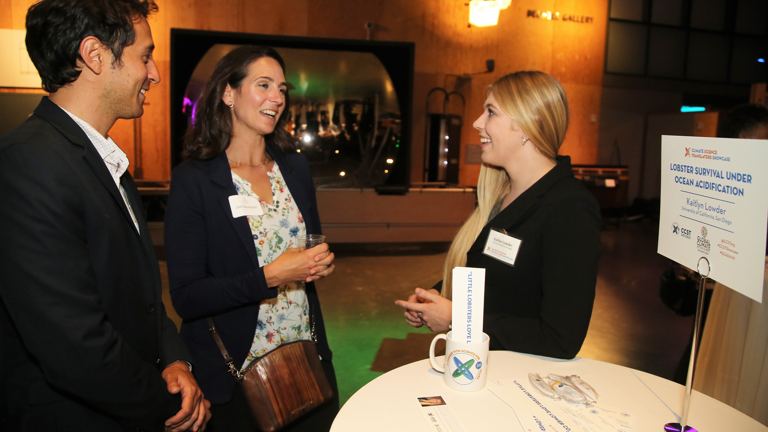 UC San Diego Scripps Institution of Oceanography doctoral student Kaitlyn Lowder explains her research on ocean acidification and juvenile crustaceans at the CCST Climate Science Translators Showcase.  The California Council on Science and Technology (CCST) hosted the CCST Climate Science Translators Showcase on Tuesday, September 11, 2018 at the Exploratorium as an Affiliate Event of the historic Global Climate Action Summit in San Francisco — held during the "Celebration of Science and Education" reception hosted by the Governor's Office of Planning and Research (OPR), CCST, the Gordon and Betty Moore Foundation, CalEPA, and Ten Strands. The #CCSTShowcase recruited and trained 12 graduate students and postdocs from California universities and research institutions to communicate their climate-related research to policy leaders, staff, and other Summit delegates.